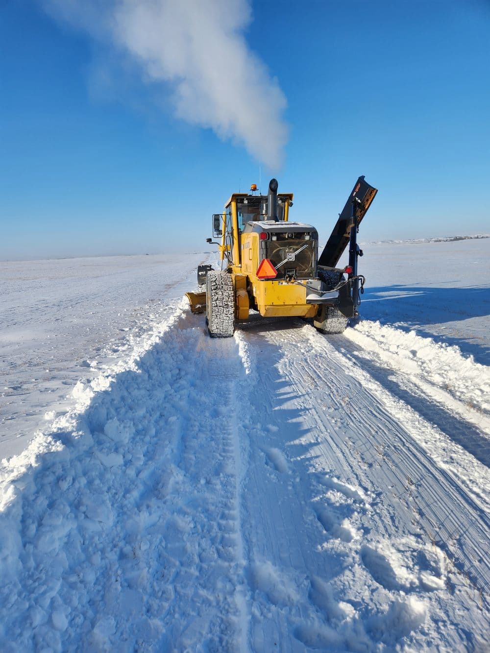 Plowing snow off of lease access road