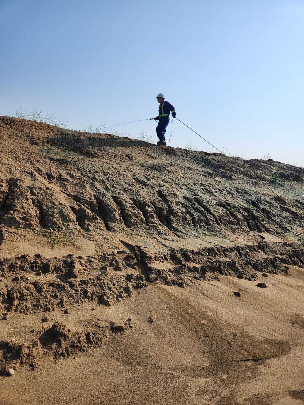 Applying Herbicide on Soil Piles